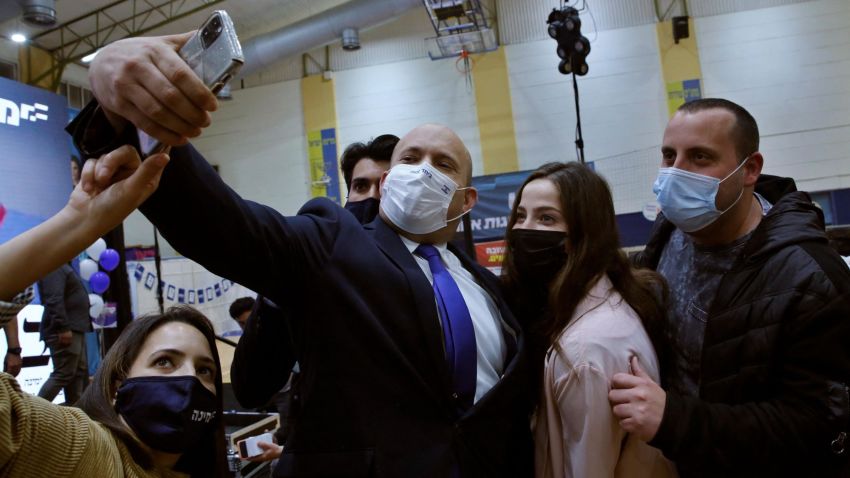 Naftali Bennett, leader of the Israeli right wing 'New Right' party, poses for a selfie picture with supporters during a campaign rally in the southern Israeli city of Sderot on March 17, 2021, ahead of the March 23 general election. (Photo by GIL COHEN-MAGEN / AFP) (Photo by GIL COHEN-MAGEN/AFP via Getty Images)