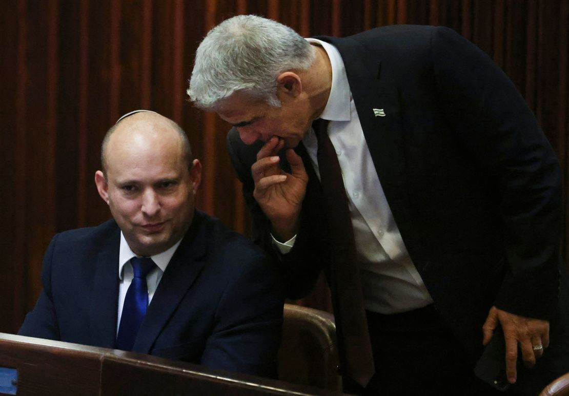 Right-wing Bennett described centrist Yair Lapid (R), his new coalition partner, as his "friend."  