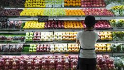 A sales assistant arranges fruit at the fresh produce section in the supermarket at the SM City Bacoor shopping mall in Bacoor, Cavite province, the Philippines, on Thursday, June 3, 2021.
