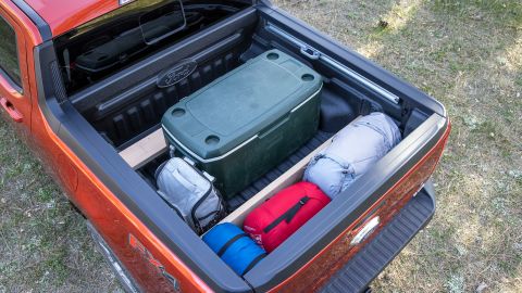 The Ford Maverick's bed has slots that allow wooden planks to be used as dividers for cargo.