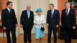 Queen Elizabeth II (C) poses with British Prime Minister David Cameron (L), and former Prime Ministers Sir John Major (2nd from L), Tony Blair (2nd from R) and Gordon Brown (R) at 10 Downing Street on July 24, 2012 in London, England.