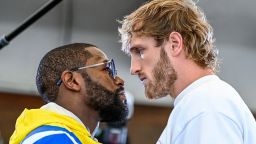 Former world welterweight king Floyd Mayweather (L) and YouTube personality Logan Paul face-off during the media availability ahead of their June 6 exhibition boxing match, on June 3, 2021 at Villa Casa Casuarina at the former Versace Mansion in Miami Beach, on June 3, 2021. (Photo by CHANDAN KHANNA / AFP) (Photo by CHANDAN KHANNA/AFP via Getty Images)