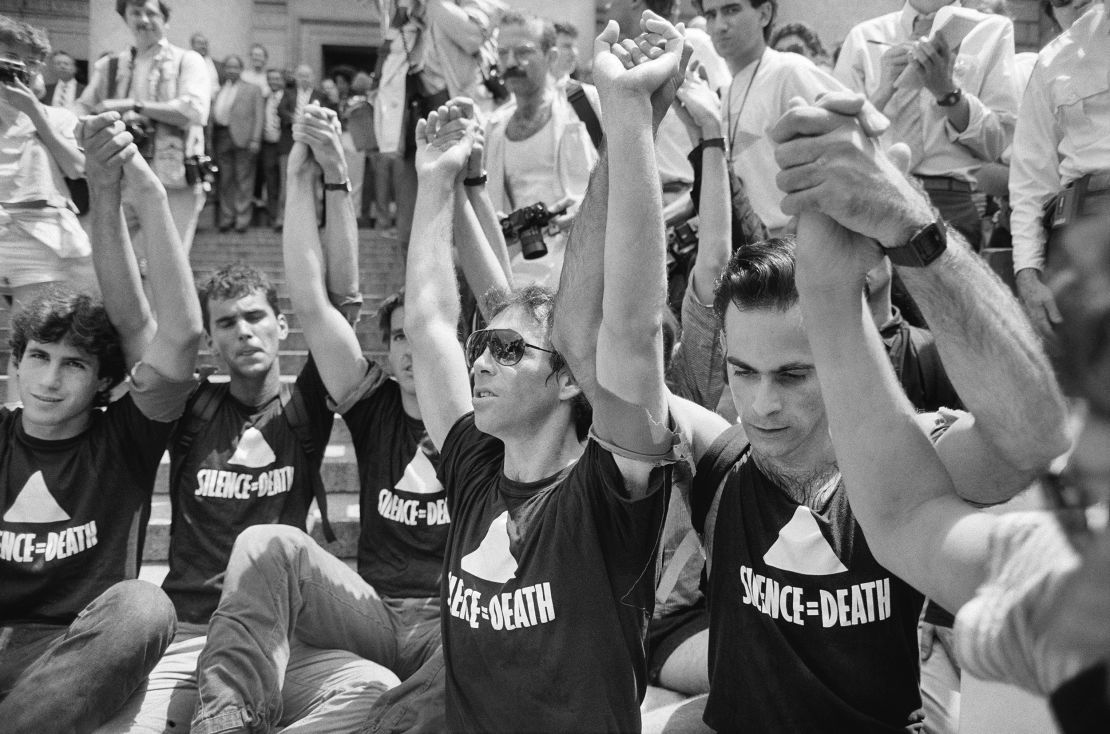 Demonstrators in New York in 1987 hold hands during a moment of silence while demanding more government action in the fight against AIDS.