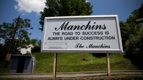A sign bearing the Manchin name appears in Farmington.