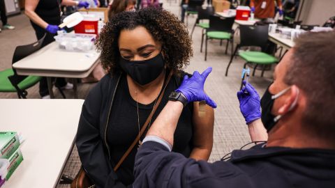 Latiah Haley receives a dose of the Johnson & Johnson vaccine at an event organized by the fire department in Thornton, Colorado, on March 6, 2021.