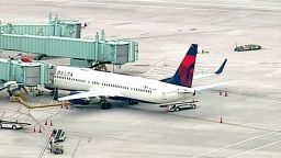 A Delta flight made an emergency stop after a passenger attempted to breach the cockpit, an official said Friday.