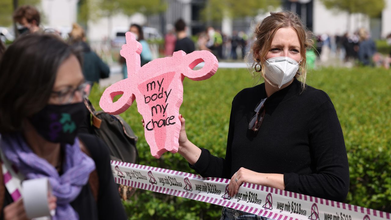 Abortion rights activists demand changes in Germany's abortion law during a protest in front of the Reichstag in Berlin on May 15, 2021. 