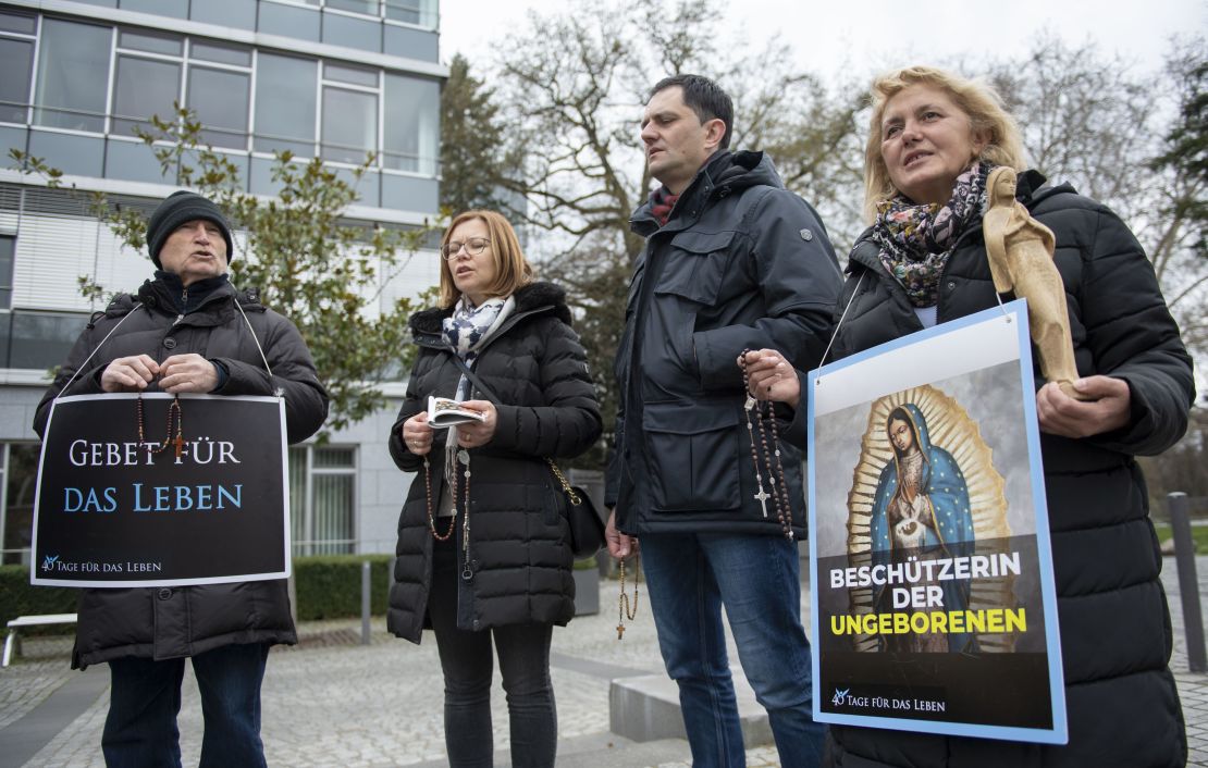Anti-abortion activists pray during a "40 Days For Life" picket outside the Pro Familia center in Frankfurt, Germany, on March 26, 2019. The state-approved center offers consultations on abortions.