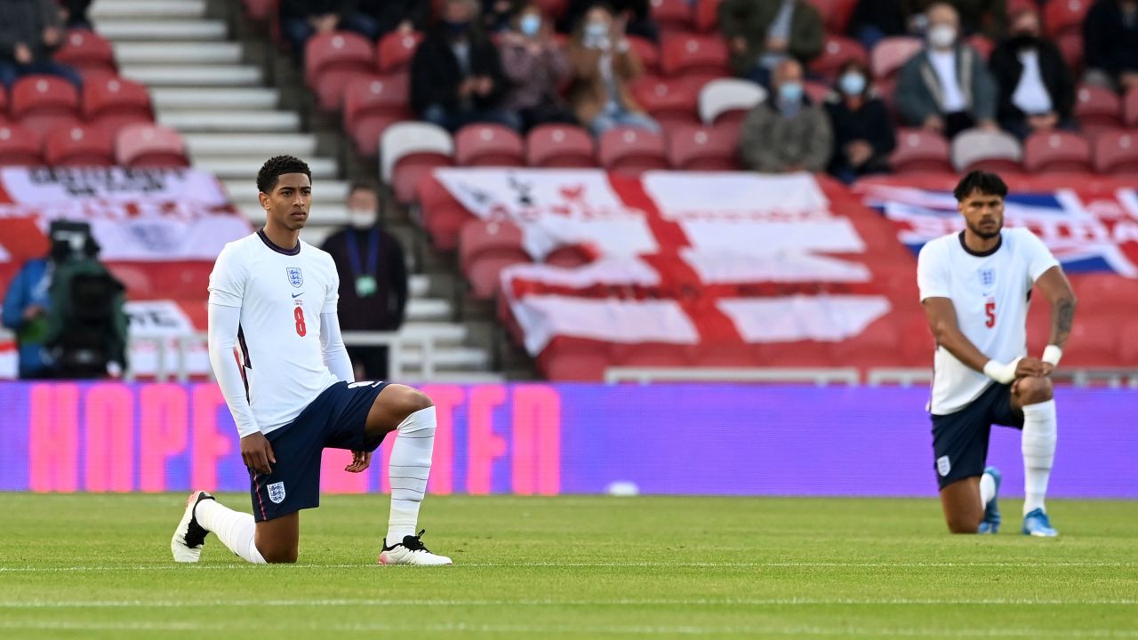 England players Jude Bellingham and Tyrone Mings of England take the knee ahead of the international friendly match against Austria at the Riverside Stadium on June 02, 2021 in Middlesbrough.