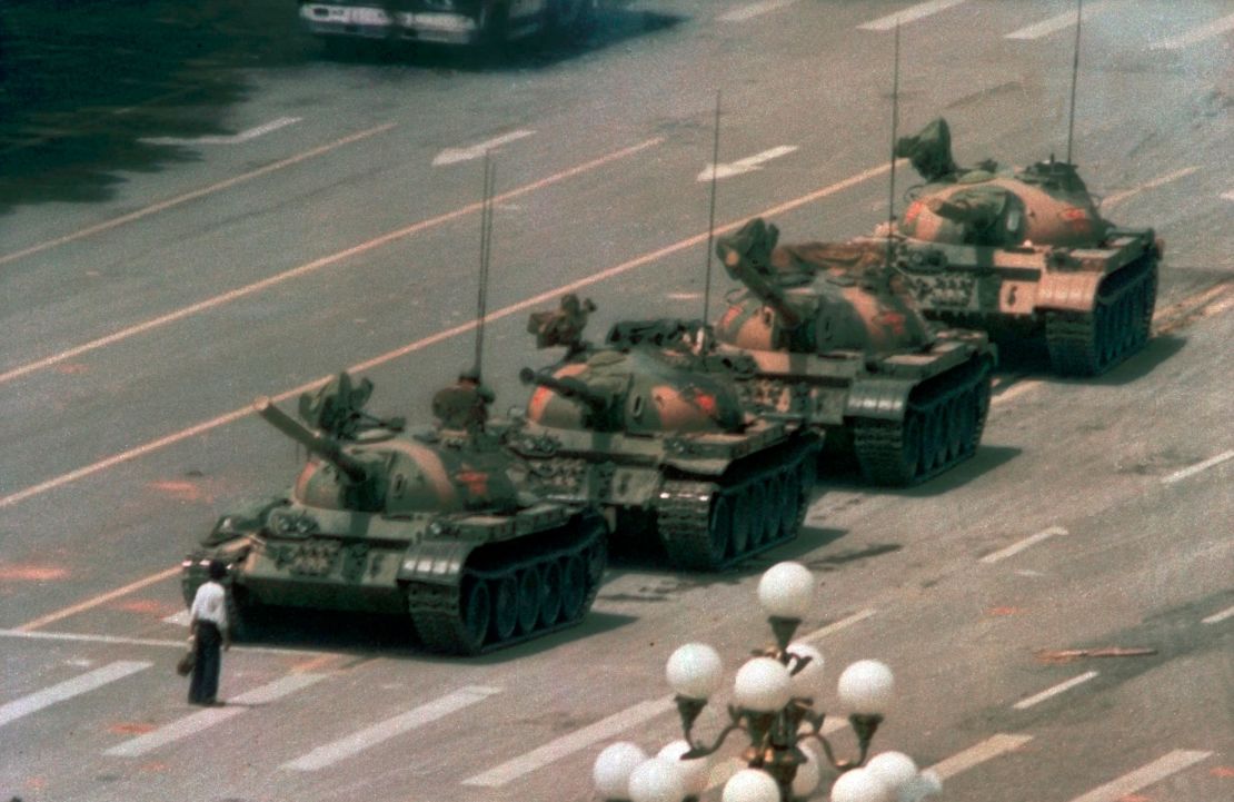 In this 1989 photo, a man stands alone to block a line of tanks heading east on Beijing's Cangan Blvd. in Tiananmen Square.