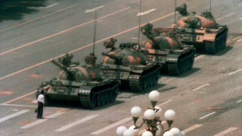In this 1989 photo, a man stands alone to block a line of tanks heading east on Beijing's Cangan Blvd. in Tiananmen Square.