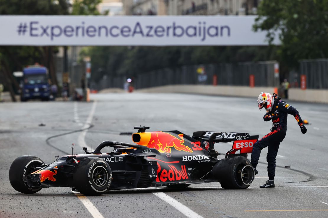 Max Verstappen kicks his tire after crashing out in Azerbaijan.