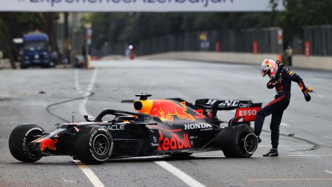Max Verstappen kicks his tire after crashing out of the Azerbaijan Grand Prix