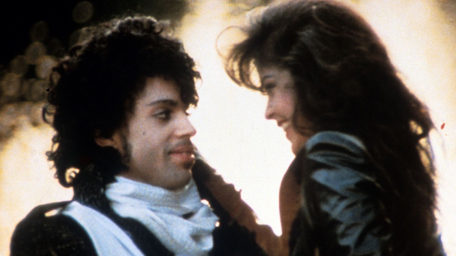 Prince embraces Apollonia Kotero in a scene from the film 'Purple Rain', 1984.