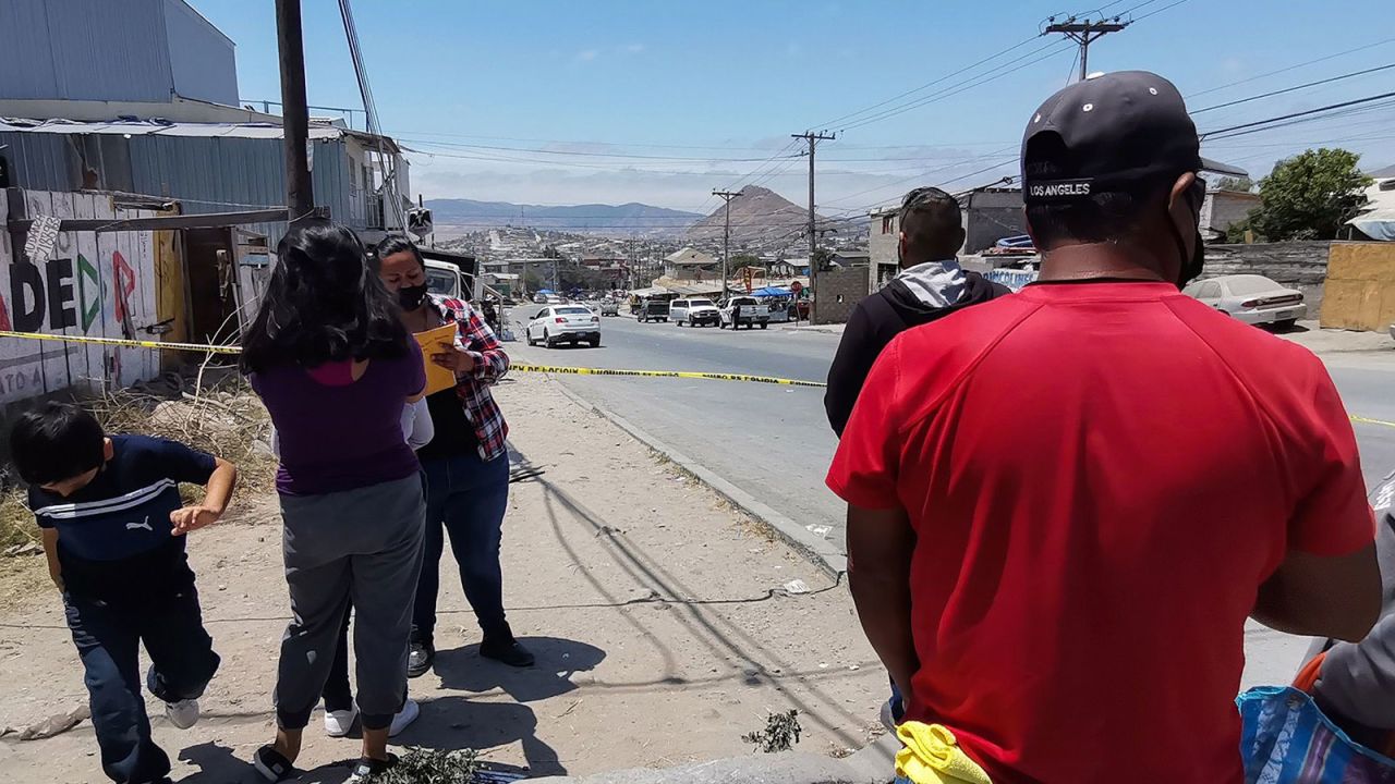 Authorities keep watch over an area where unidentified human remains were dumped during the election day in Baja California state, Mexico, on June 6, 2021.