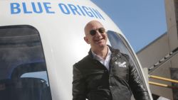 Jeff Bezos, chief executive officer of Amazon.com Inc. and founder of Blue Origin LLC, smiles while speaking at the unveiling of the Blue Origin New Shepard system during the Space Symposium in Colorado Springs, Colorado, U.S., on Wednesday, April 5, 2017. Bezos has been reinvesting money he made at Amazon since he started his space exploration company more than a decade ago, and has plans to launch paying tourists into space within two years. Photographer: Matthew Staver/Bloomberg via Getty Images