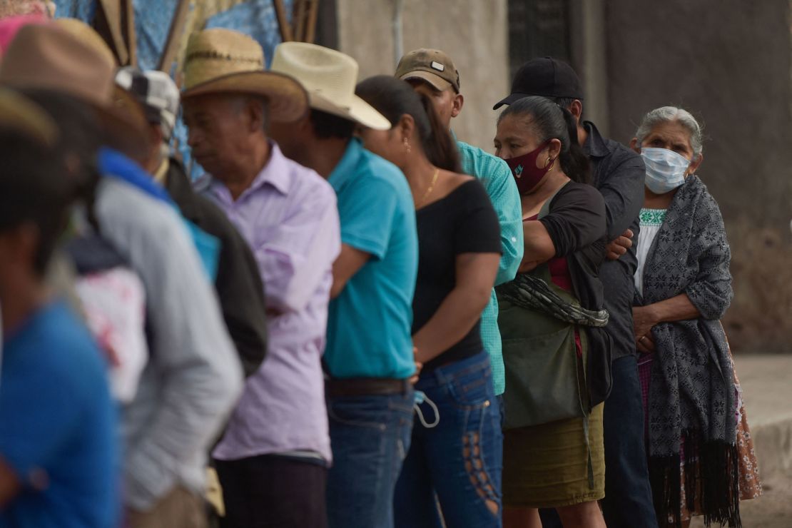 People queue to cast their vote at a polling station in Atzacoalco, Guerrero state, Mexico, on June 6, 2021.