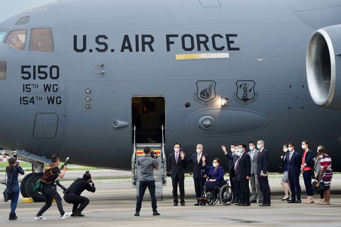 US senators are seen in front of the US Air Force C-17 Globemaster III freighter upon their arrival at Taipei's Songshan Airport on June 6.