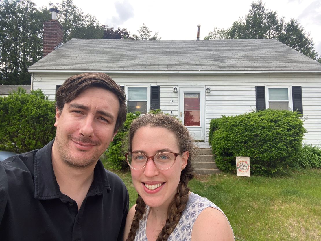 John Wright and Maura Quinn in front of the home they sold in a matter of days in Burlington, Vermont, before starting a home search in St. Louis.