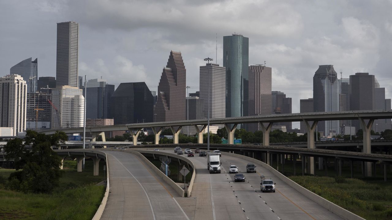 Traffic moves past the skyline of Houston in June 2020.