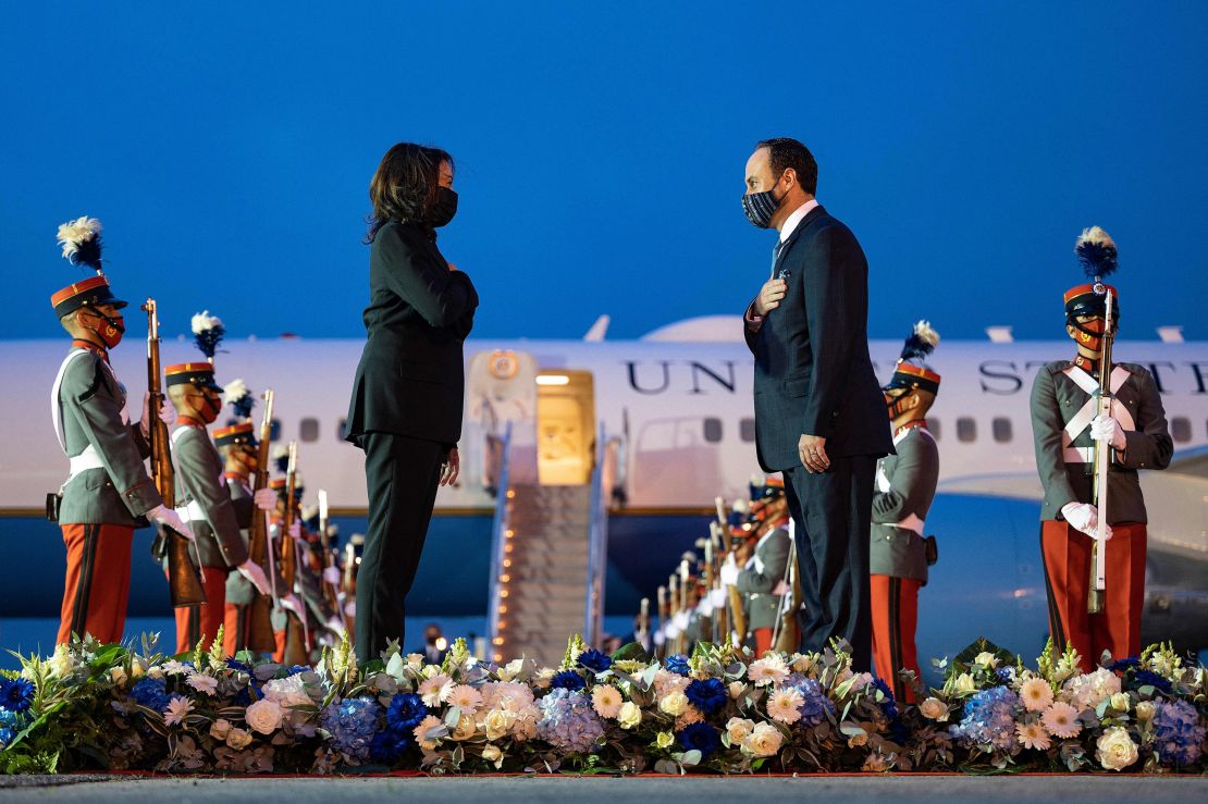 Harris and Guatemala's Minister of Foreign Affairs Pedro Brolo face each other and place their right hand over their heart upon arrival at the Aeropuerto Internacional La Aurora in Guatemala City on June 6.