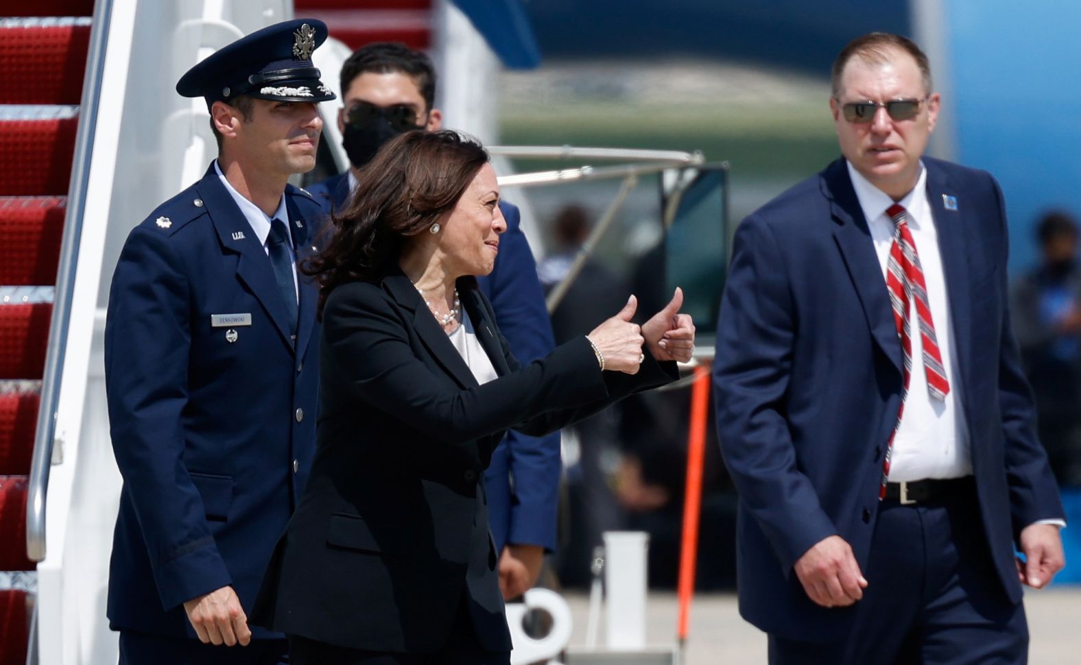 Harris gives the thumbs-up gesture as she gets off the Air Force Two <a href="https://www.cnn.com/2021/06/06/politics/kamala-harris-plane-technical-issue-foreign-trip-guatemala/index.html" target="_blank">after technical difficulties</a> made her change planes at Joint Base Andrews in Maryland on June 6.