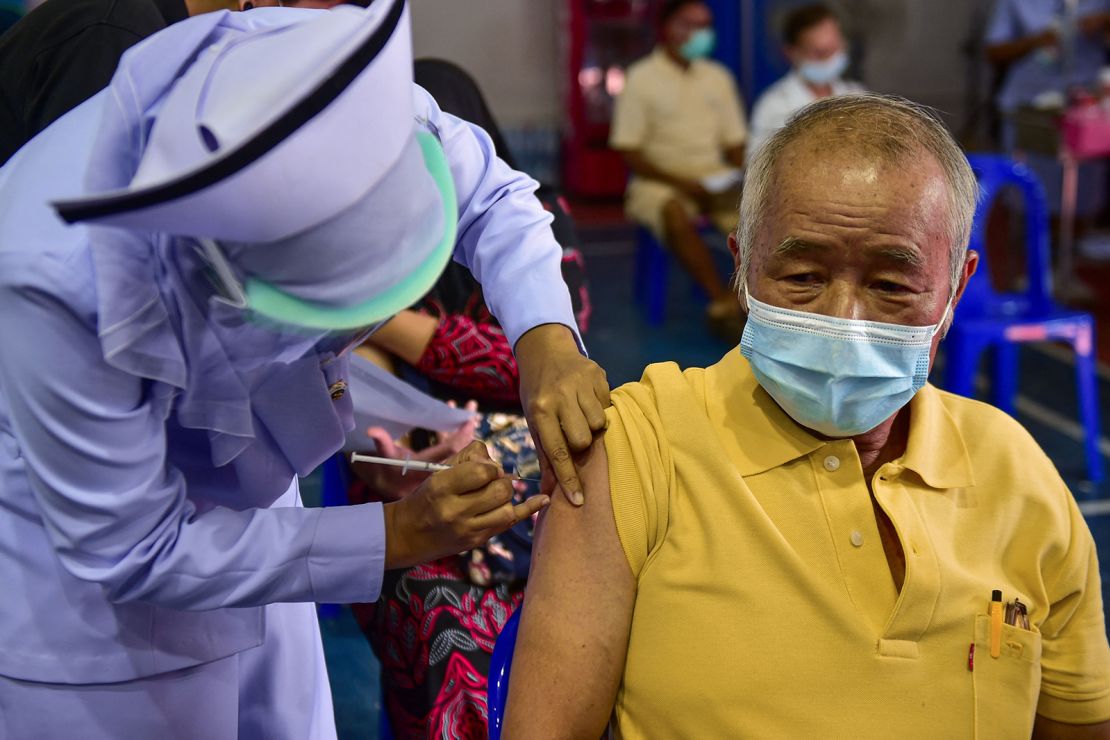 A nurse administers a dose of the AstraZeneca Covid-19 coronavirus vaccine at the Narathiwat Hospital compound in the southern province of Narathiwat on June 7.