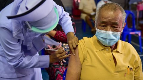A nurse administers a dose of the AstraZeneca Covid-19 coronavirus vaccine at the Narathiwat Hospital compound in the southern province of Narathiwat on June 7.