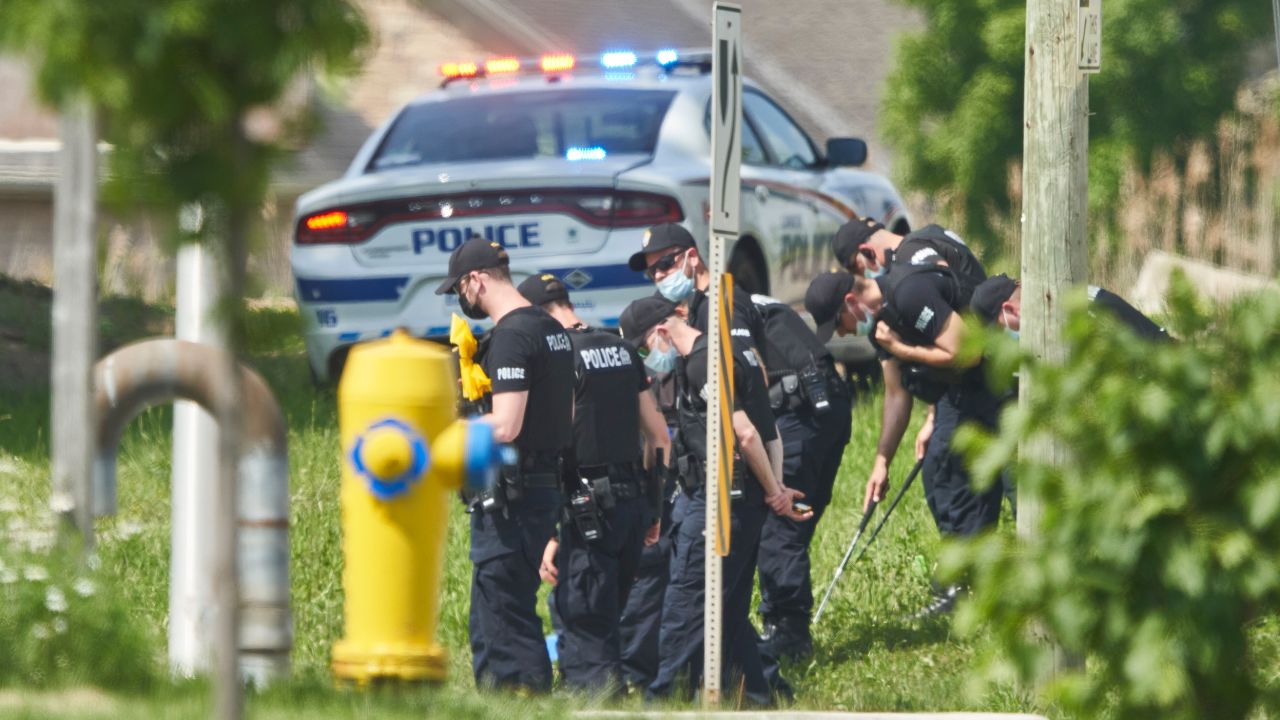 Police officers search for evidence at the scene of the attack in London, Ontario, on Monday, June 7.