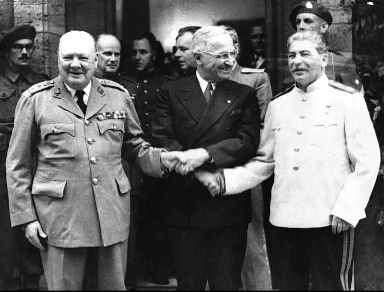 From left, Churchill, Truman and Stalin shake hands during the Potsdam Conference.