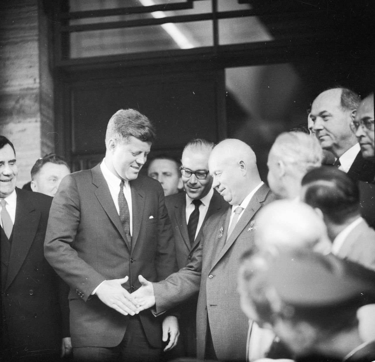Khrushchev shakes hands with US President John F. Kennedy as they meet for a two-day summit in Vienna, Austria, in 1961. <a href="https://www.cnn.com/2016/03/03/politics/nixon-versus-kennedy-what-if-nixon-won/index.html" target="_blank">Historians agree that Kennedy did poorly in his negotiations,</a> which came two months after the failed Bay of Pigs invasion in Cuba. A year later, it was discovered that the Soviets had deployed nuclear missiles in Cuba — just 90 miles from the United States.
