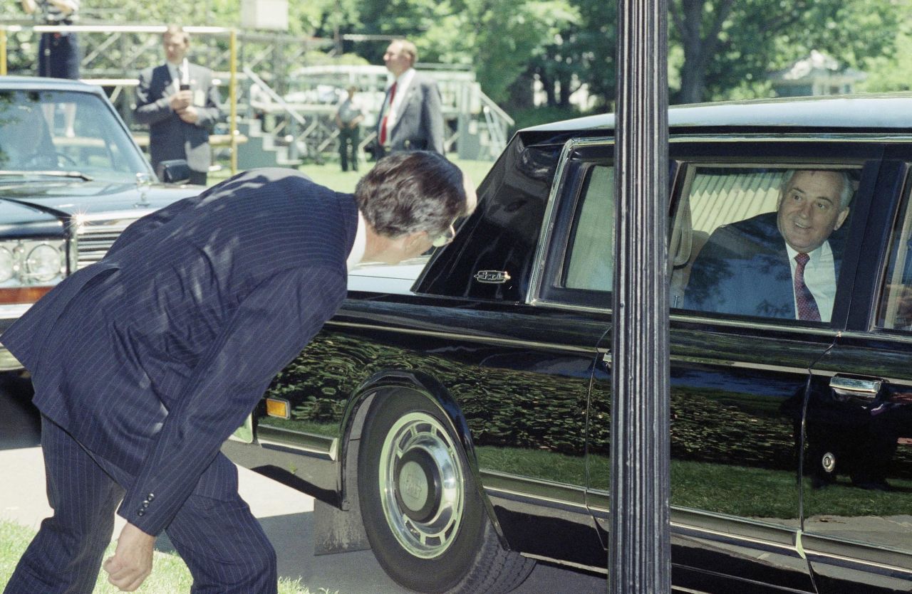Bush watches Gorbachev leave the White House after the two leaders held talks in 1990.