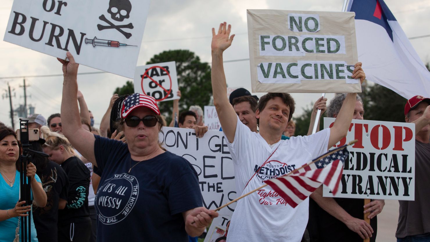 Protesters outside Houston Methodist Baytown Hospital in Baytown, Texas, on Monday, June 7. A small group of employees and supporters were protesting the hospital's policy of requiring employees to be vaccinated against Covid-19.