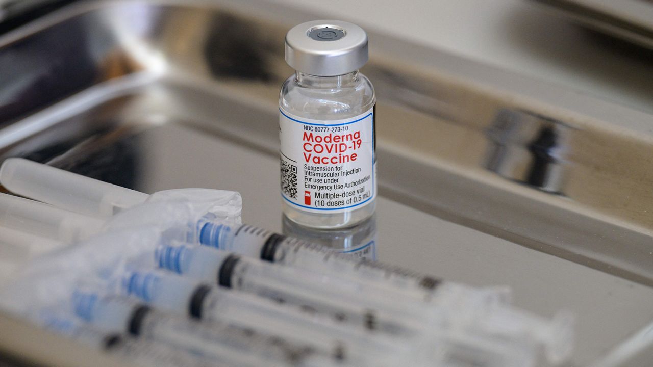 A vial of the Moderna Covid-19 vaccine and syringes sit prepared at a pop up vaccine clinic at the Jewish Community Center on April 16, 2021 in the Staten Island borough of New York City. (Photo by Angela Weiss / AFP) (Photo by ANGELA WEISS/AFP via Getty Images)