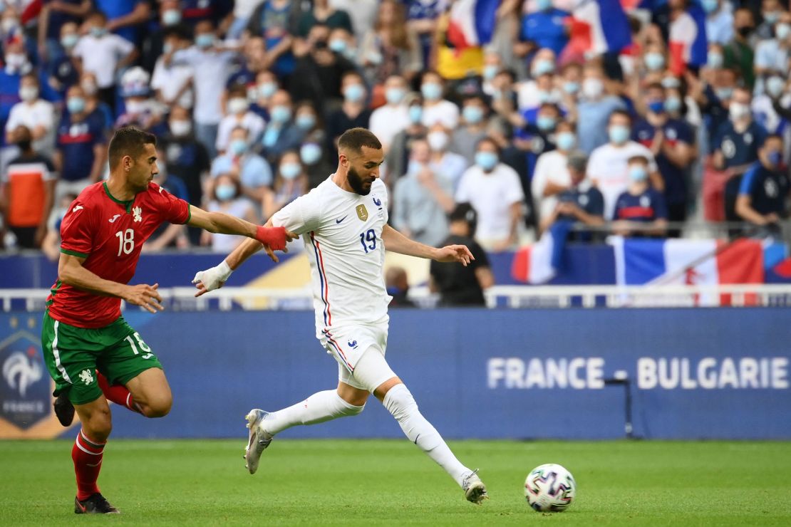 France forward Karim Benzema (R) prepares to strike the ball during the friendly football match against Bulgaria ahead of the Euro 2020 tournament, at Stade De France in Saint-Denis, on the outskirts of Paris on June 8, 2021.