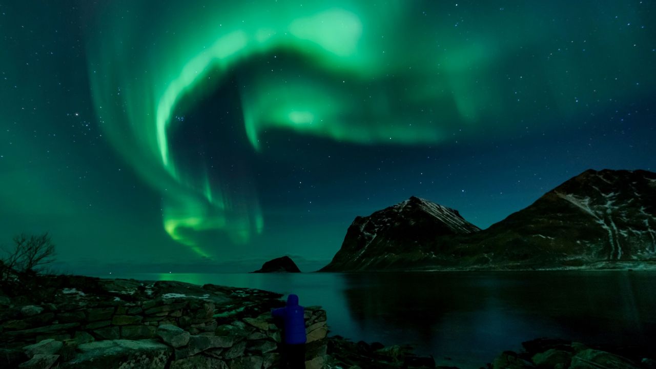 A person watches the northern lights on March 9, 2018, in Utakleiv, northern Norway.