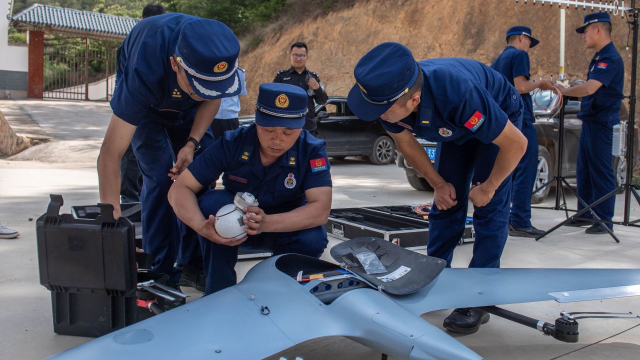 Workers prepare a drone to monitor the migrating wild Asian elephants in Eshan County, Yuxi City, southwest China's Yunnan Province on May 29.