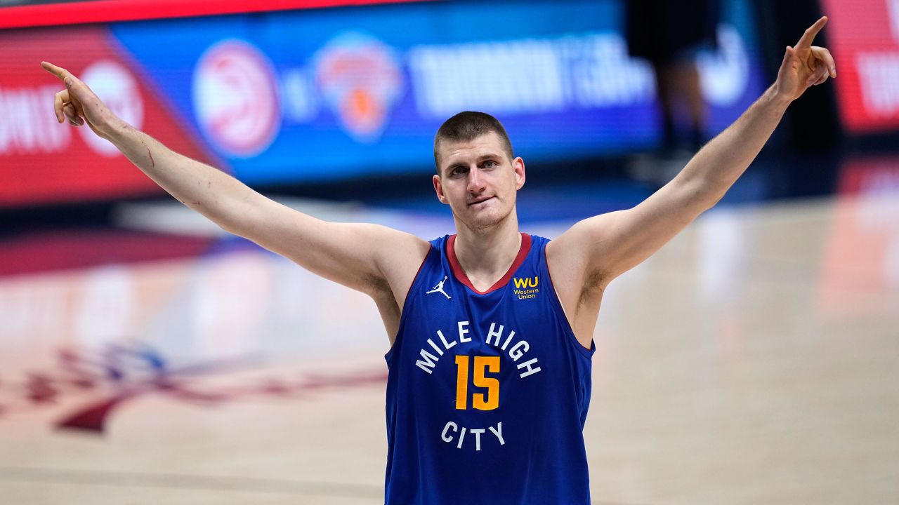Denver Nuggets center Nikola Jokic celebrate the team's double-overtime win against the Portland Trail Blazers in Game 5 of their first-round playoff series.