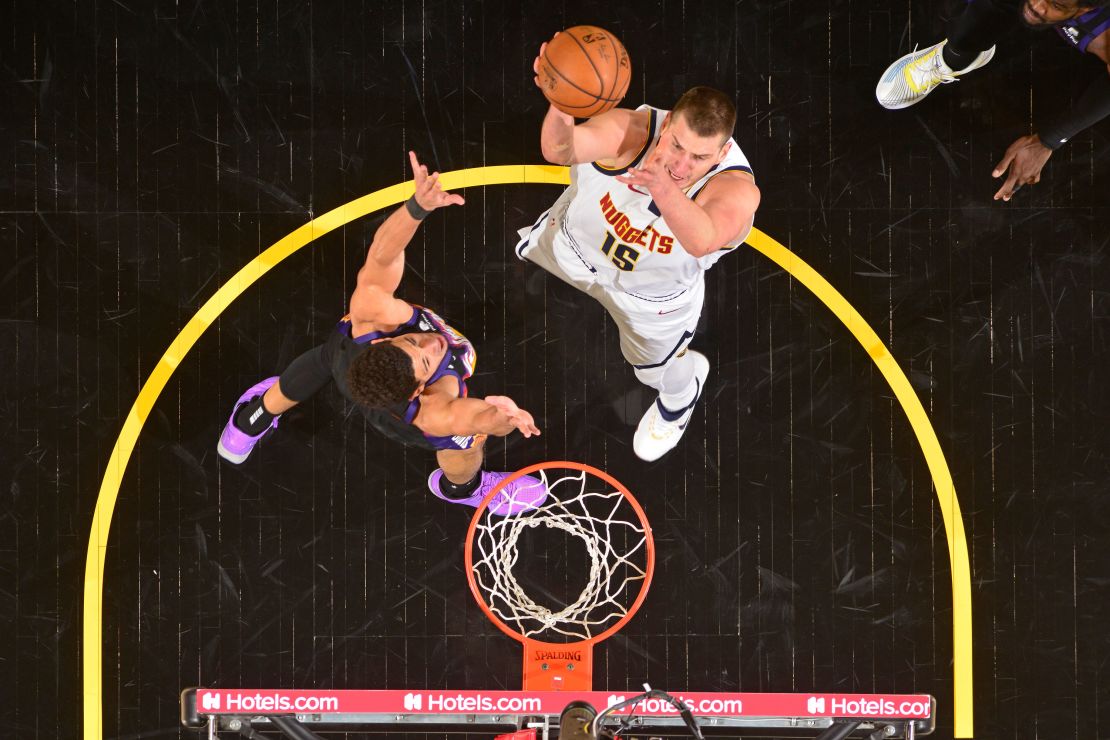Jokic shoots the ball against the Phoenix Suns.