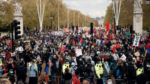 Aima was flanked by two White allies at the march in May. Assigned by a trusted volunteer group, they are there to help keep her safe.