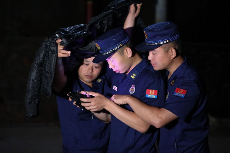 Officials use a drone to track the herd in Kunming, Yunnan province, on June 5.
