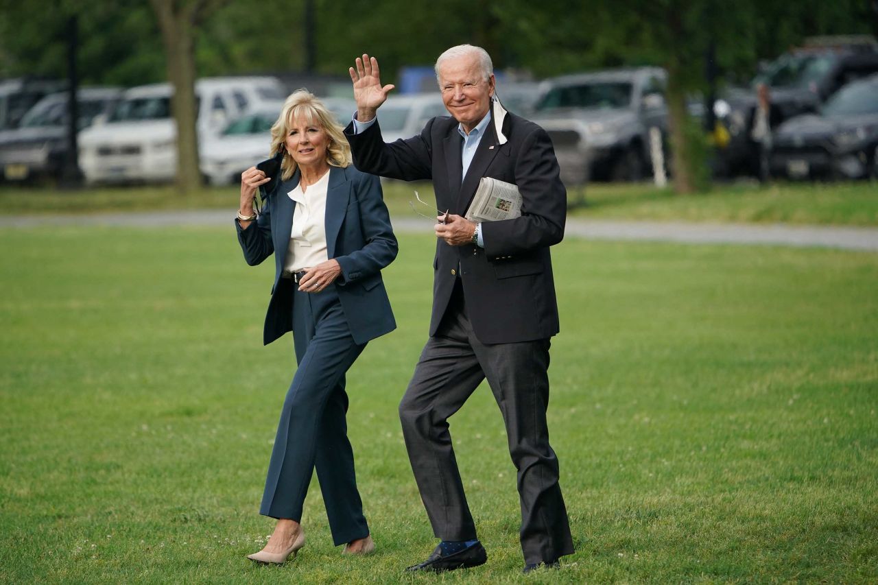 The Bidens make their way to Marine One for the start of their trip.