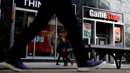 People pass by GameStop at 6th Avenue on March 23, 2021 in New York. 