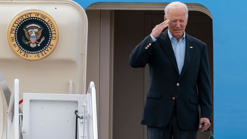 President Joe Biden salutes as he boards Air Force One upon departure, Wednesday, June 9, 2021, at Andrews Air Force Base, Md.