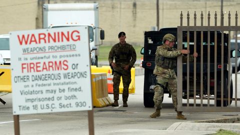 Military police close a gate at Joint Base San Antonio-Lackland on Wednesday after it was put on lockdown.