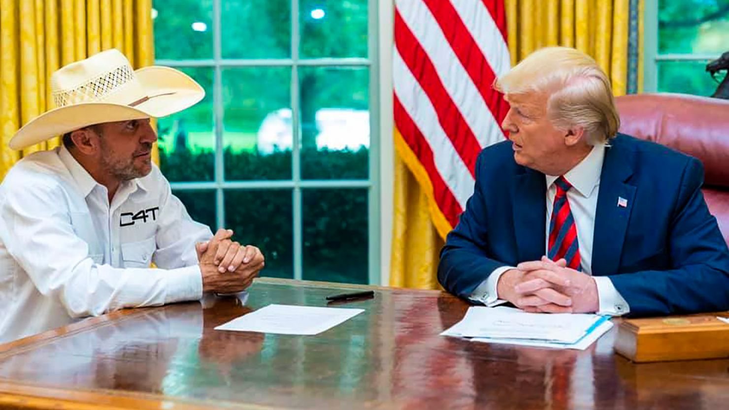 Couy Griffin poses with President Donald Trump in the Oval Office of the White House on September 12, 2019. Note: This photo has been removed from the White House Flickr page.