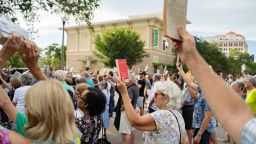 Demonstrators raises a book they bring which represent ‚Äúeducation leads to understanding‚Äù during the Unite Against Hate vigil on Thursday, June 3, 2021, outside of the Florida Holocaust Museum in response to the vandalism of their building with anti-semitic traffic last week in St. Petersburg.