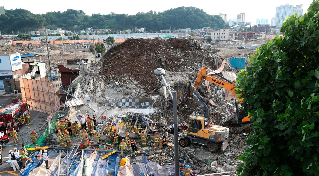 Firefighters search for survivors in Gwangju, on June 9, 2021.