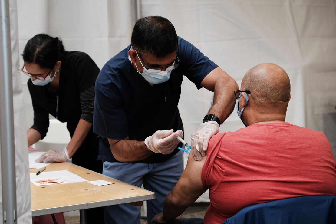 People get Covid-19 vaccination shots on May 12 at the Broadway Junction subway station in New York City. The pop-up site was part of a citywide initiative to get more New Yorkers and tourists vaccinated. 