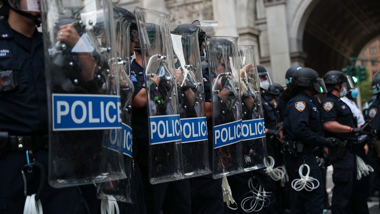 NEW YORK, USA - JULY 1: Police officers stand guard during âBlack Lives Matterâ protest as protesters locked down the streets by City Hall and Police Plaza where hundreds of Black Lives Matter protestors congregate at the City Hall as part of the "Defund NYPD" and "Occupy City Hall" movement continues in New York City, United States on July 1, 2020. (Photo by Tayfun Coskun/Anadolu Agency via Getty Images)